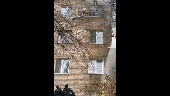 Firefighters rescue boy from window ledge during fire in Orenburg, Russia