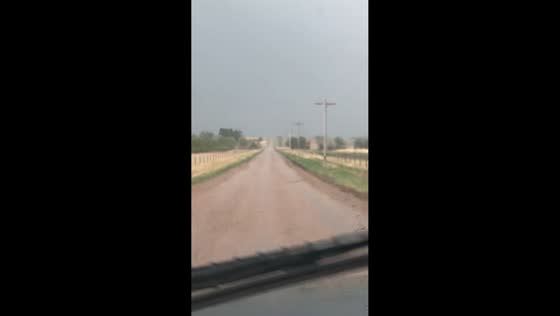 Light rain showers move across rural roads in Colorado, USA