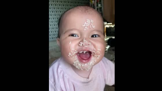 Adorable child ends up with rice stuck on face in playful moment in Kapuas Hulu, Indonesia