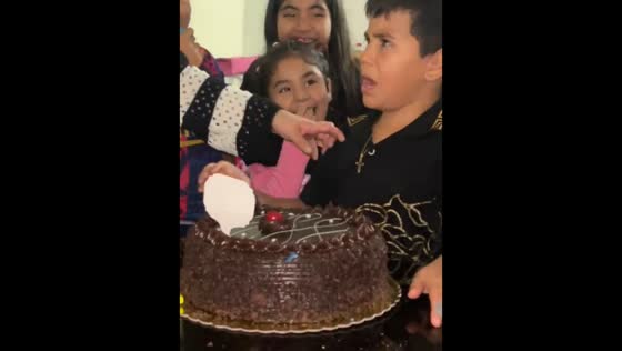 Child startled and cries after cake prank on birthday in Lima, Peru