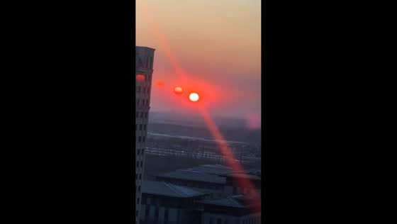 Rare sun dog illusion creates appearance of three suns in Hebei, China 