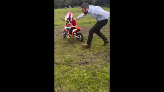 Dad quickly pulls child off bike to prevent crash in South Wales, UK