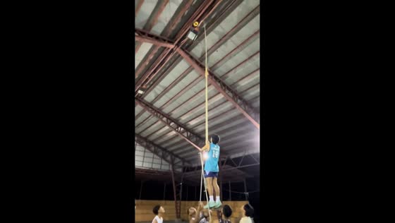 Volleyball gets stuck on covered court roof during game in Calapan, Philippines
