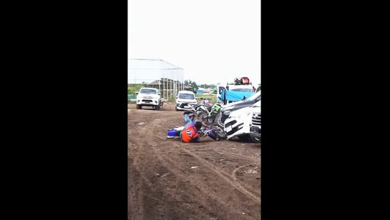 Attraction mishap: motorbike stunt ends in car bumper wreckage