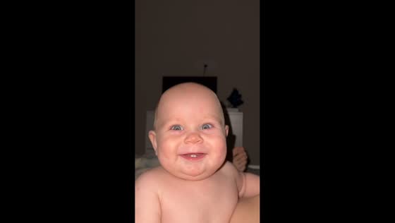 Baby smiles and gets excited after mom laughs in Krasnodar, Russia