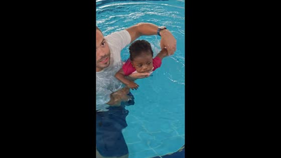 Sleepy baby dozes off during swimming lesson in Cairo, Egypt