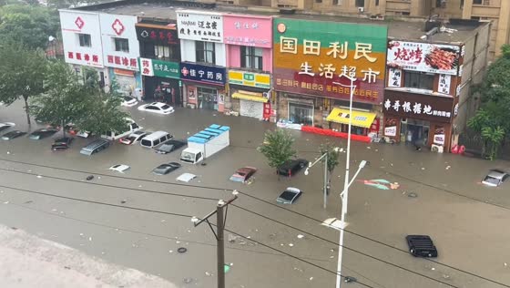 Severe flooding submerges parked cars on Xihe Road in Liaoning, China