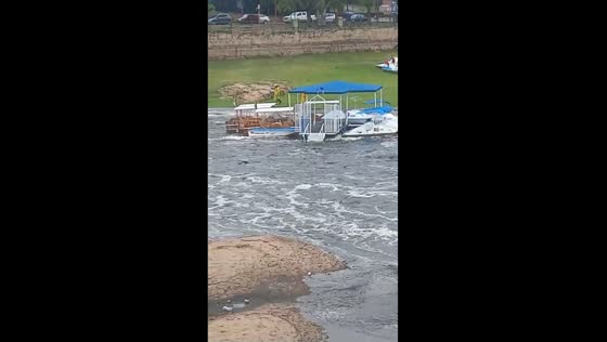 Floodwaters sweep peddle boats downstream in Villa Carlos Paz, Argentina