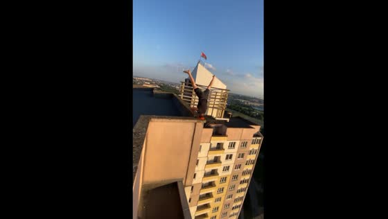 Man performs headstand on high-rise building edge in Minsk, Belarus