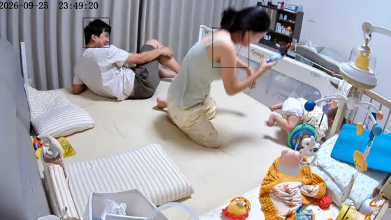Baby gets stuck after rolling into bed corner in Zhejiang, China