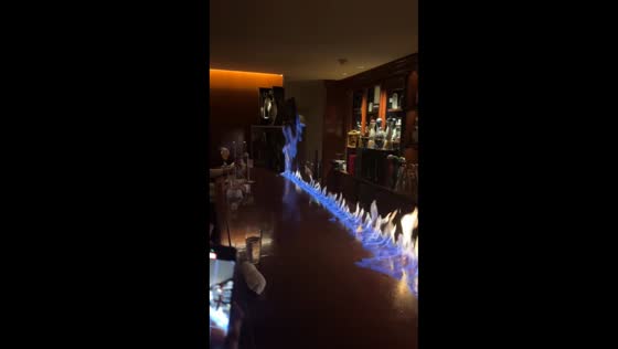 Tokyo bartender creates blue flame display before serving