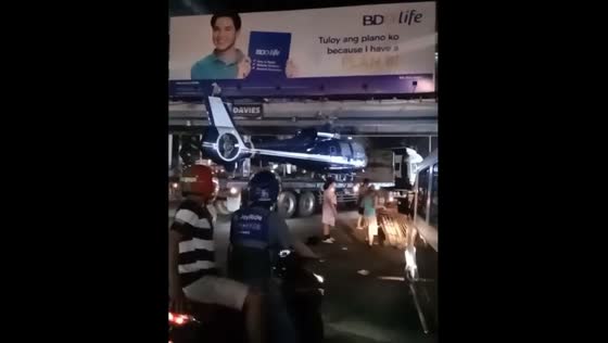 Helicopter on trailer too tall for Edsa Balintawak Bridge