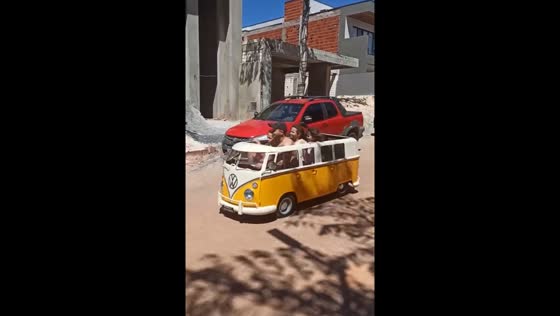 Family rides minibus in Arniqueira, Brazil