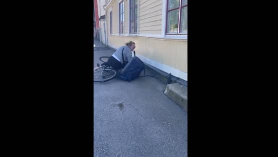 Bicycle riders fall while chatting in Öregrund, Sweden