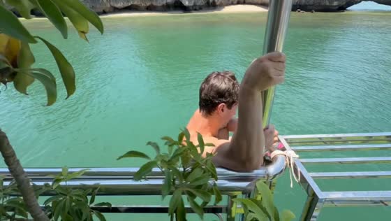 Man slips off boarding platform and falls into water on Cát Bà Island, Haiphong, Vietnam