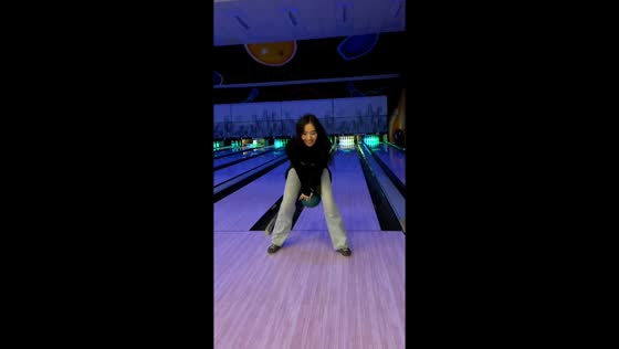 Woman gets a strike while bowling backward in Almaty, Kazakhstan