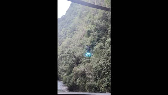 Man soars over canyon river on homemade electric hoverboard in Hubei, China