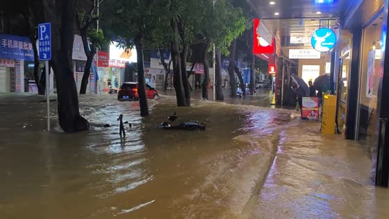 Severe flooding submerges streets and vehicles in Yangchun, China