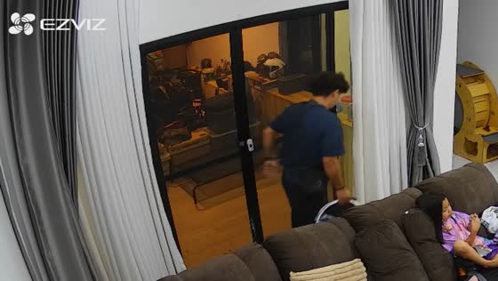 Woman trips and falls while dog leans against her back inside family home in Hua Hin, Thailand