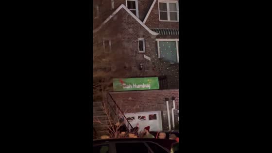 "Buh Humbug" banner amidst Christmas decorations in Brooklyn, New York, USA