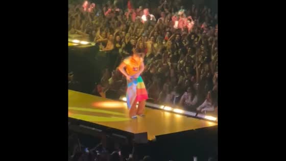 Harry Styles used the pride flag as a skirt to hide his ripped pants