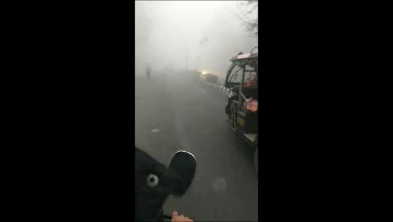 Dense fog and cold wave disrupt travel in East Delhi, India