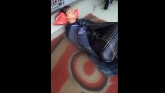 Flooding Wake-Up Call: Guy Sleeps Through Flood After Late-Night Gaming on Terrace in Makassar, Indonesia