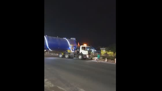 Extra-long vehicle navigates turn in Klaten, Indonesia
