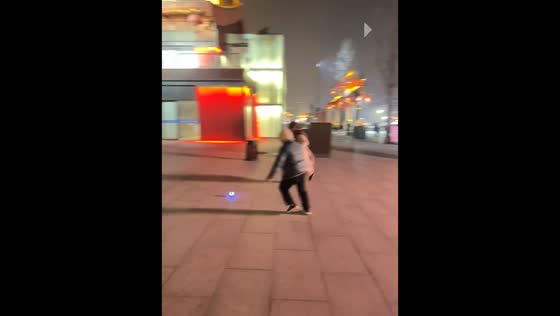 Light-up ball rolls across public plaza, Shaanxi, China