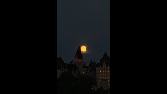 Coppery moon rises over Ottawa during deep partial lunar eclipse in Canada