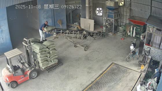 Man falls when a stack of sacks collapses in a warehouse in Jiangsu, China