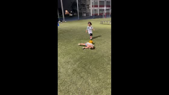 Boy trips during children’s soccer game in Kanie, Aichi, Japan