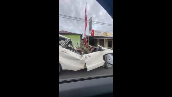 Broken car spotted driving on the road in Jailolo, Maluku, USA
