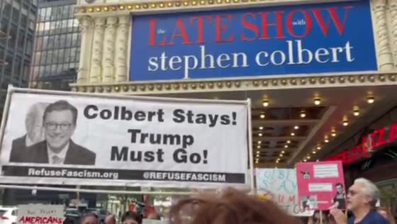 Demonstrators rally against Colbert show cancellation outside Ed Sullivan Theater in New York, USA