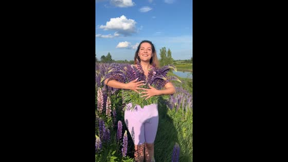 Ryazan woman filmed with lupines in pants