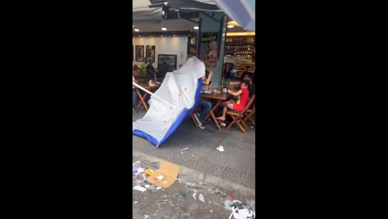 Parasol umbrella flies and hits diners in Sao Paulo, Brazil