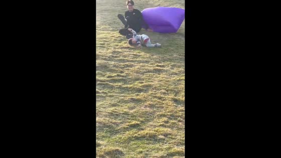 Father and son fall off balloon while playing on slide in Guangdong, China