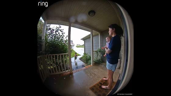 Boy runs indoors after loud thunderclap in Spartanburg, USA