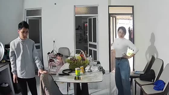 Little boy bumps head under table at home in Vietnam 