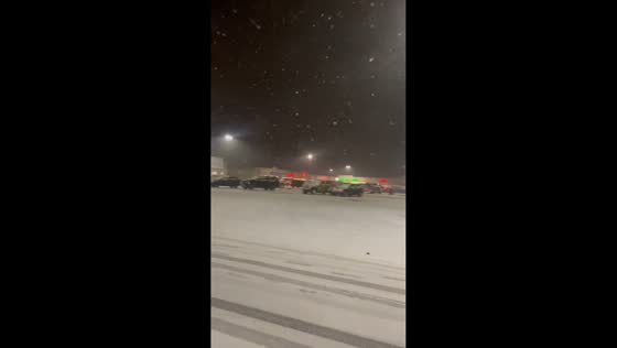 Heavy snow blankets parking lot in Bluefield, West Virginia, USA