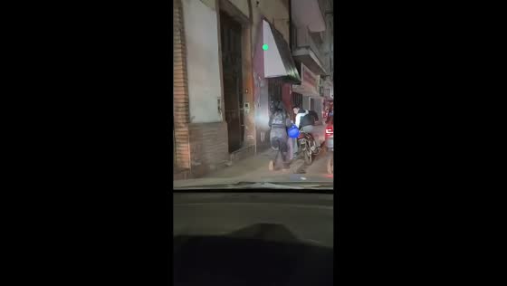 Motorcycle passenger falls after hitting uneven pavement in San Miguel de Tucumán, Argentina