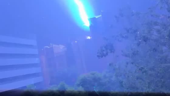 Lightning bolt flashes over city skyline during severe storm in Barcelona, Spain