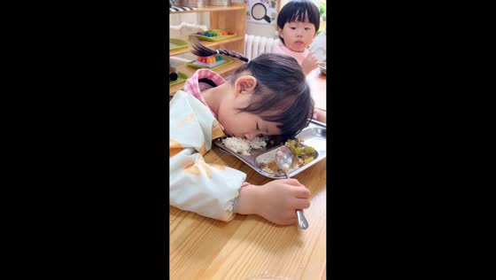 Sleepy student nods off during lunch break in Liaoning, China