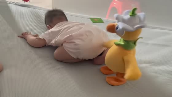 Baby startled by toy duck's sudden movement in Jiangxi, China