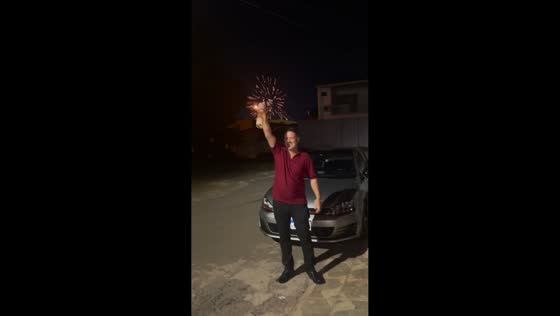 Unexpected synchronized fireworks during champagne pop in Gama, Brazil