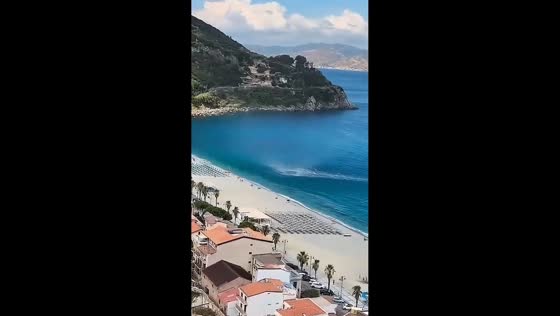 Waterspout moves ashore and sends beach furniture flying in Scilla, Italy