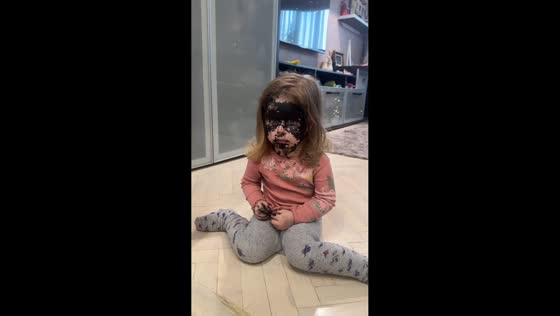 Child uses herself as a canvas after running out of paper in Chișinău, Moldova