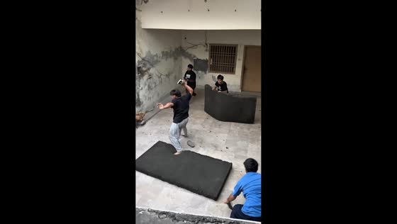 Boys turn rubber slippers into dodgeballs during playful game in Lahore, Pakistan
