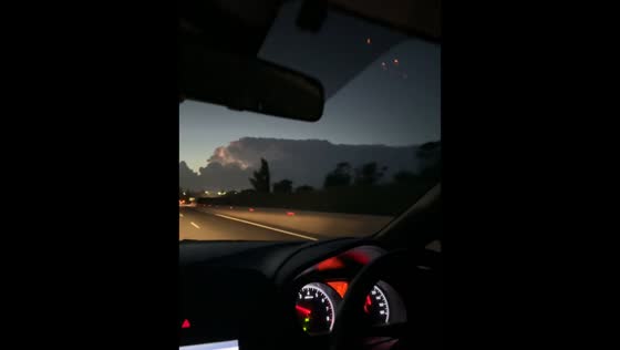 Massive thunderstorm cloud looms over highway near Nicosia, Cyprus