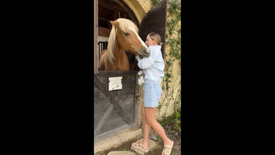 Woman startled after horse bites her arm in Bali, Indonesia